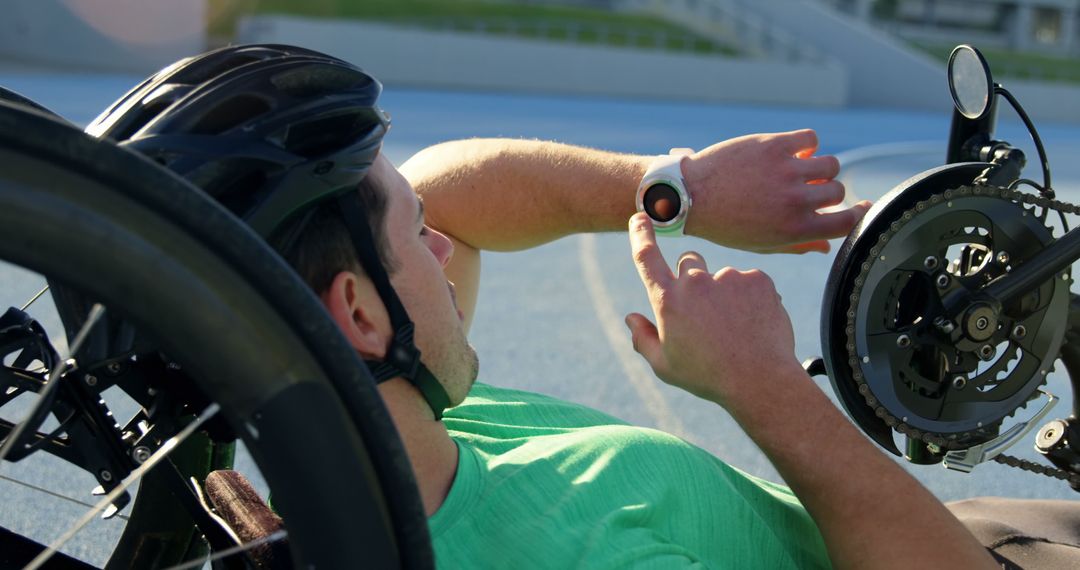 Disabled Athlete Using Smartwatch During Handcycling Training - Free Images, Stock Photos and Pictures on Pikwizard.com