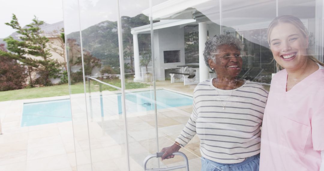 Elderly Woman with Caregiver Enjoying Time Together by the Pool - Free Images, Stock Photos and Pictures on Pikwizard.com