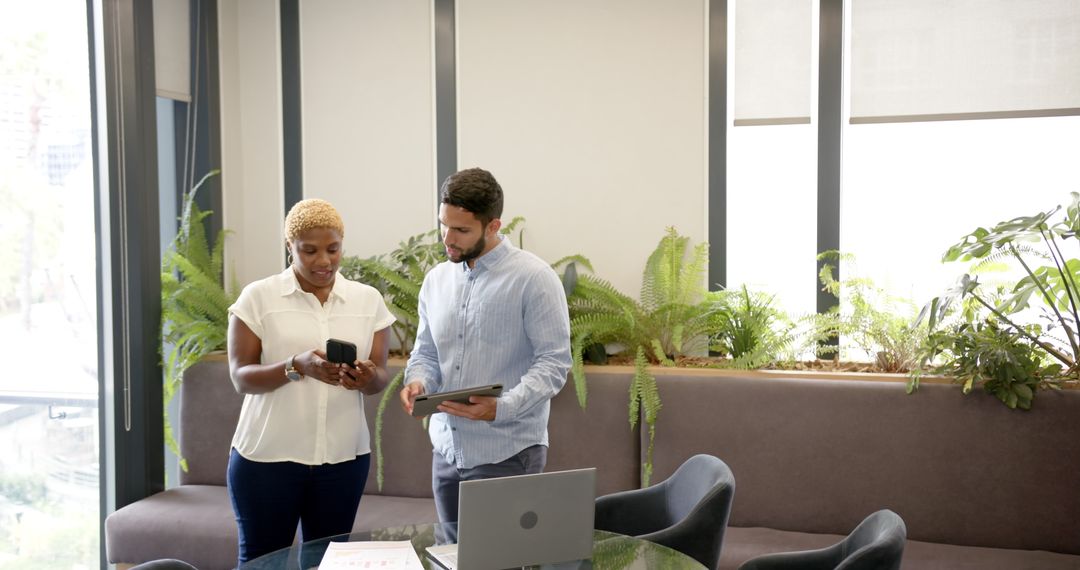 Diverse Business Colleagues Collaborate with Technology in Modern Office