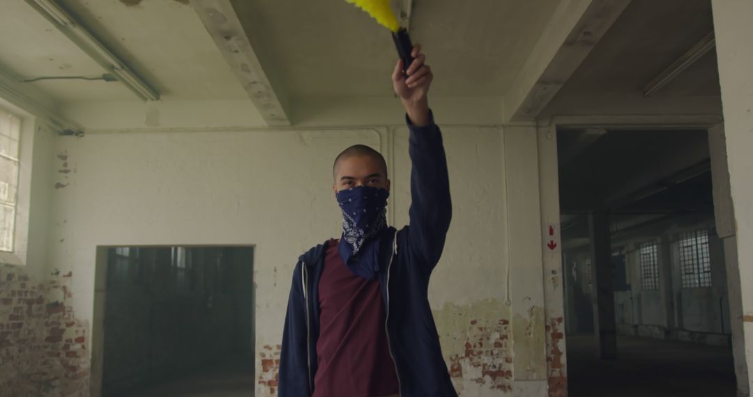 Street Artist Holding Paint Roller in Abandoned Building - Free Images, Stock Photos and Pictures on Pikwizard.com