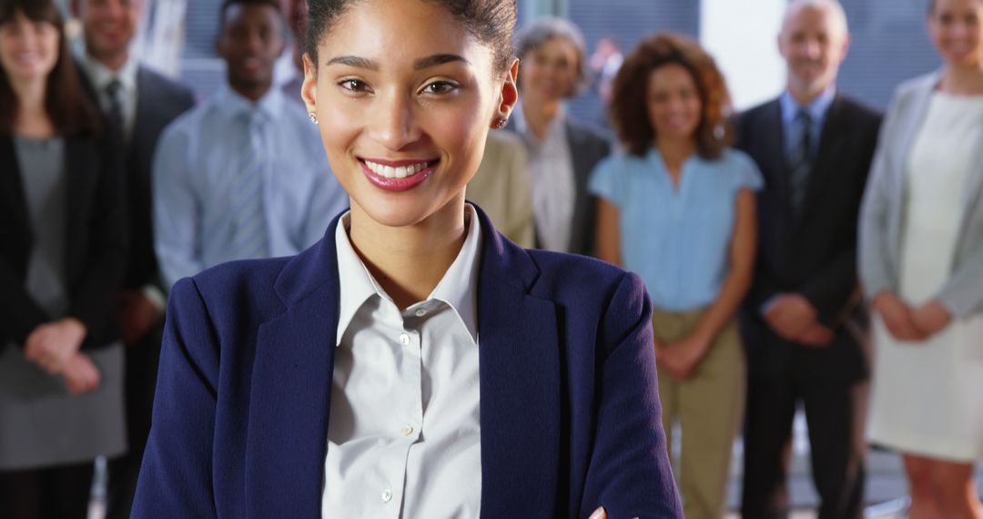 Confident Female Leader Standing with Team in Corporate Environment - Free Images, Stock Photos and Pictures on Pikwizard.com