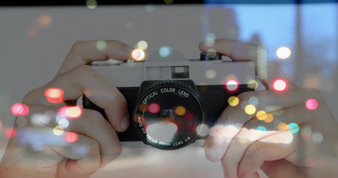 Capturing urban nightscape with vintage camera and bokeh