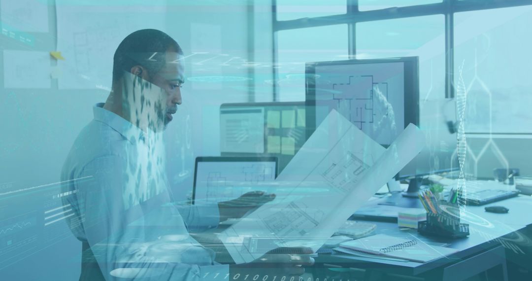 Architect reviewing blueprints with data overlays on office monitors for high-tech design