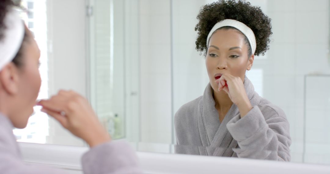 Woman Brushing Teeth in Bright Modern Bathroom - Free Images, Stock Photos and Pictures on Pikwizard.com