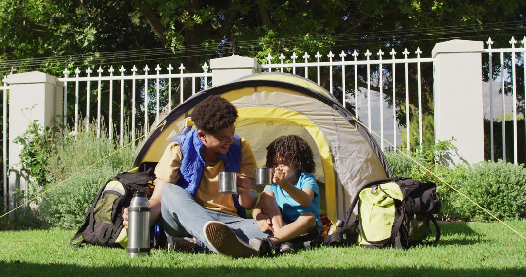 Father and Son Camping in Backyard with Tent - Free Images, Stock Photos and Pictures on Pikwizard.com