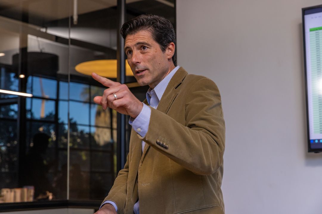 Businessman Presenting Data in Modern Boardroom