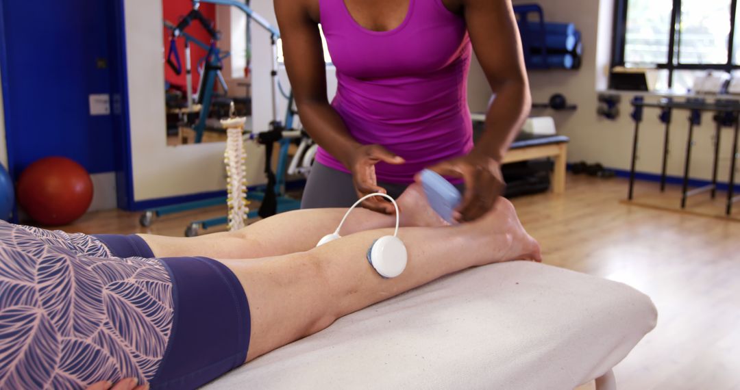 Physical Therapist Applying Ultrasound Therapy to Leg - Free Images, Stock Photos and Pictures on Pikwizard.com