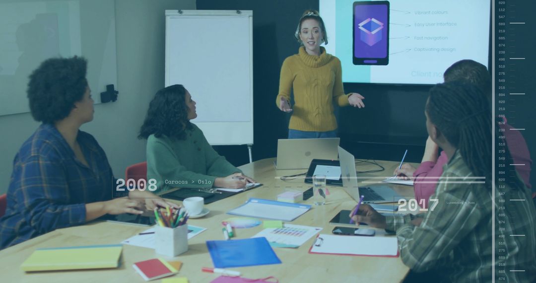 Diverse Team Analyzing Digital Data in Modern Meeting Room