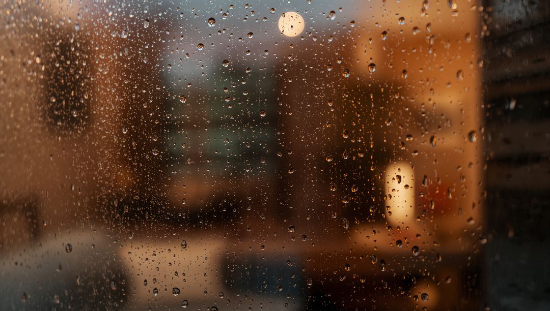 Moody Urban Rainy Evening Through Window with Bokeh