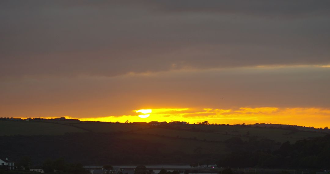 Serene Countryside Sunset Over Rolling Hills and Valleys - Free Images, Stock Photos and Pictures on Pikwizard.com