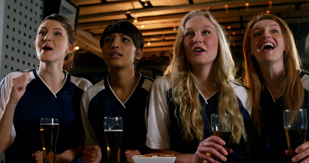 Diverse Group of Women in Uniforms Enjoying Drinks - Free Images, Stock Photos and Pictures on Pikwizard.com