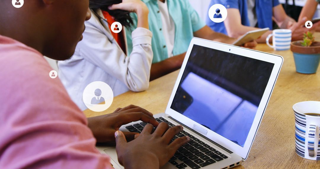 Multiracial Team Collaborating with Technology Icons Concept