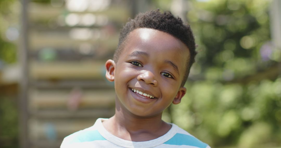 Smiling African American Child in Outdoor Setting - Free Images, Stock Photos and Pictures on Pikwizard.com