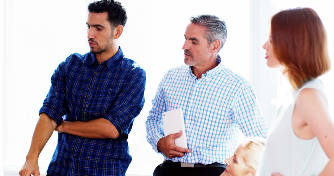 Diverse Group Engaged in Intense Discussion Collaboration