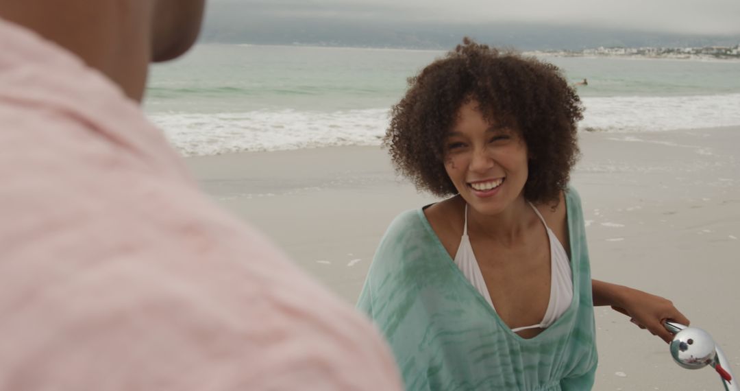 Smiling Woman Enjoying Beach Day - Free Images, Stock Photos and Pictures on Pikwizard.com