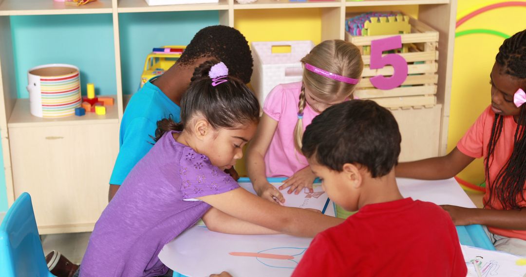 Children Drawing Together at Classroom Table in Colorful Kindergarten - Free Images, Stock Photos and Pictures on Pikwizard.com