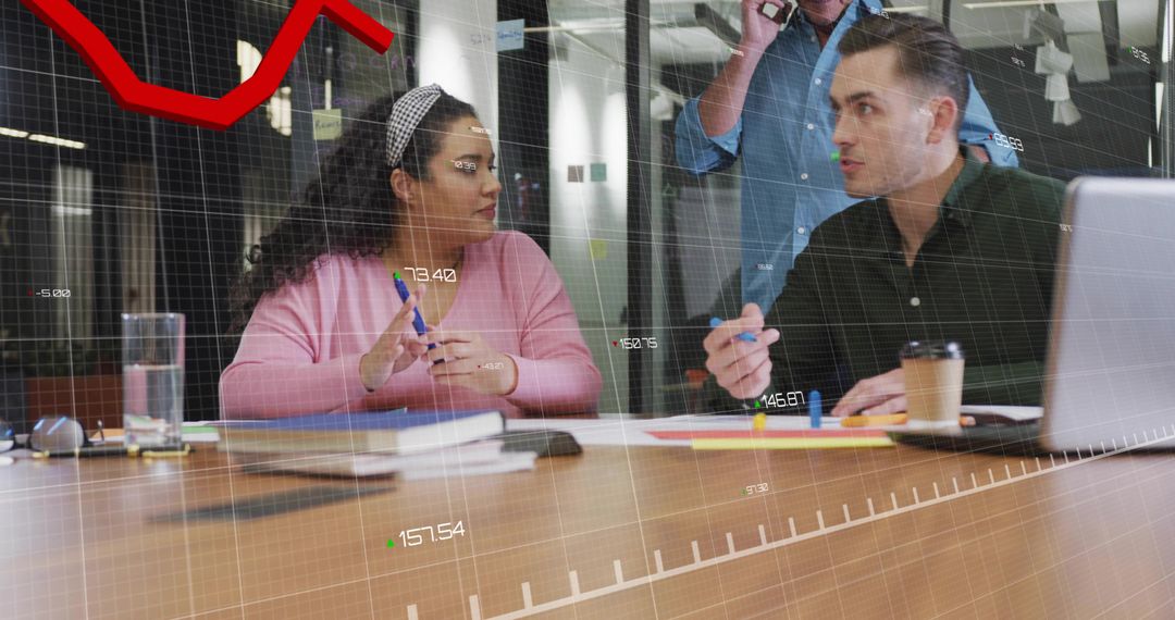 Collaborating team analyzing financial data overlay during strategy meeting, modern office