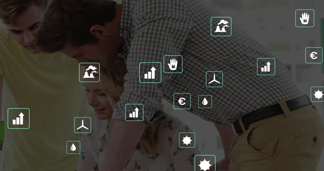 Collaborative team leaning over laptop reviewing sustainability dashboards and energy data