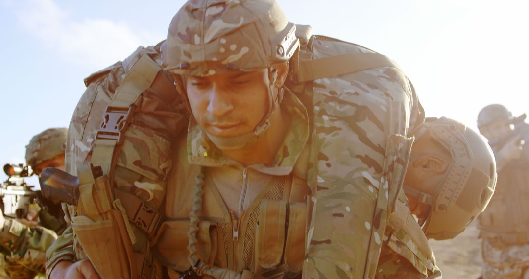 Soldier Carrying Injured Comrade During Military Training Exercise - Free Images, Stock Photos and Pictures on Pikwizard.com