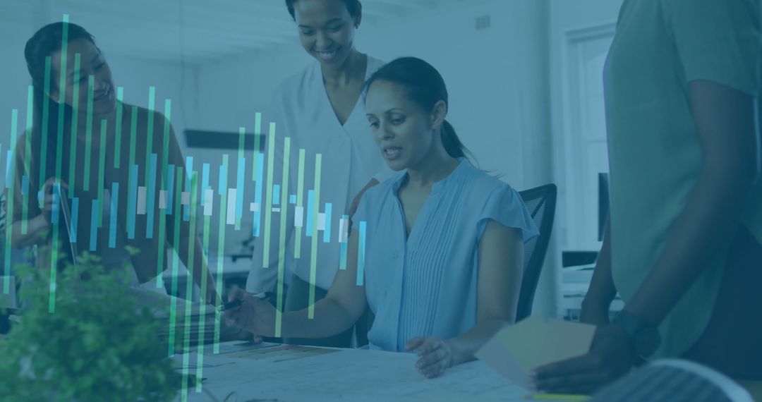 Businesswomen Collaborating in Modern Office with Data Visualization Overlay