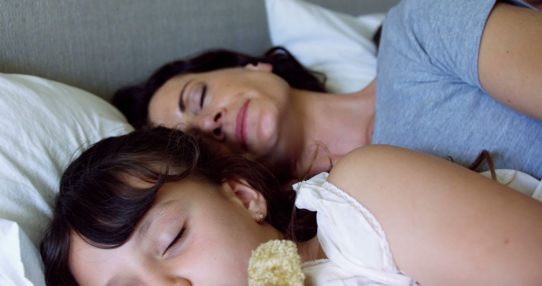 Mother and Daughter Sleeping Together in Cozy Bed - Free Images, Stock Photos and Pictures on Pikwizard.com