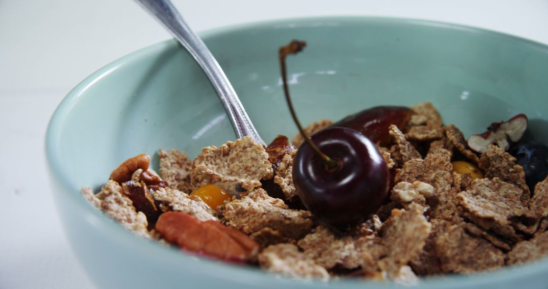 Healthy Breakfast Cereal with Fresh Cherry in Light Blue Bowl - Free Images, Stock Photos and Pictures on Pikwizard.com