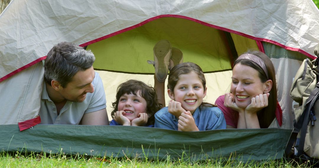 Happy Family Relaxing Together in Camping Tent, Outdoor Adventure - Free Images, Stock Photos and Pictures on Pikwizard.com