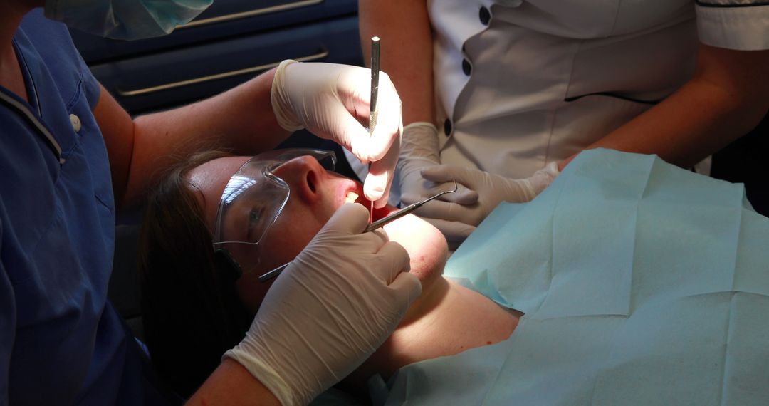 Close-up of Patient Receiving Dental Treatment at Clinic - Free Images, Stock Photos and Pictures on Pikwizard.com