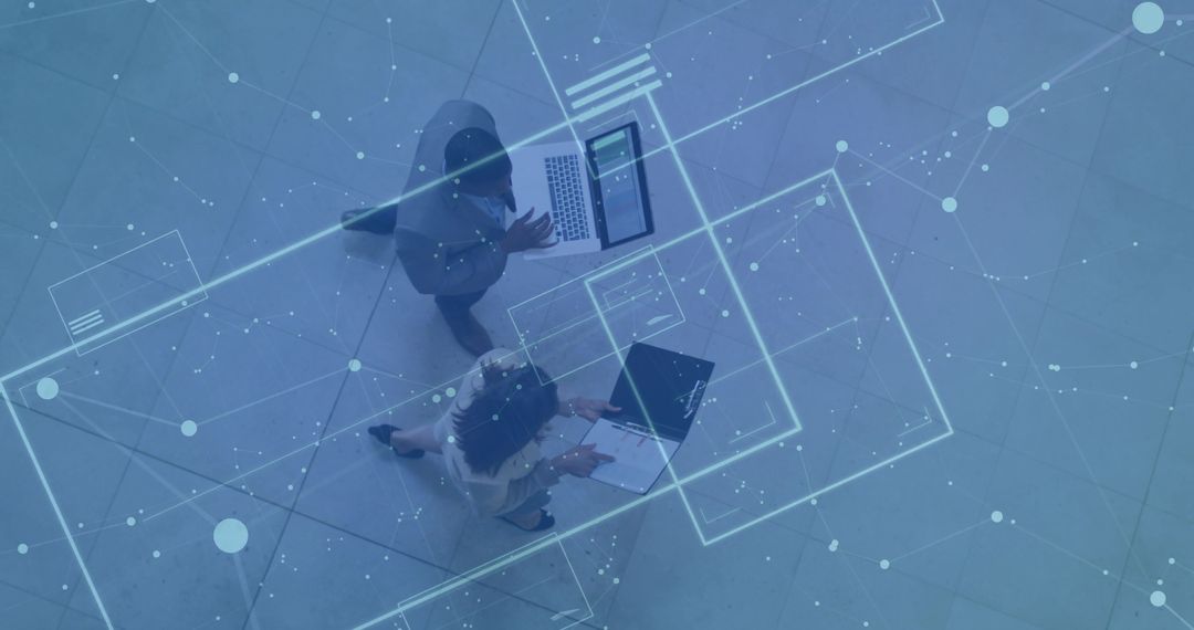 Business Professionals Examining Holographic Technology in Atrium