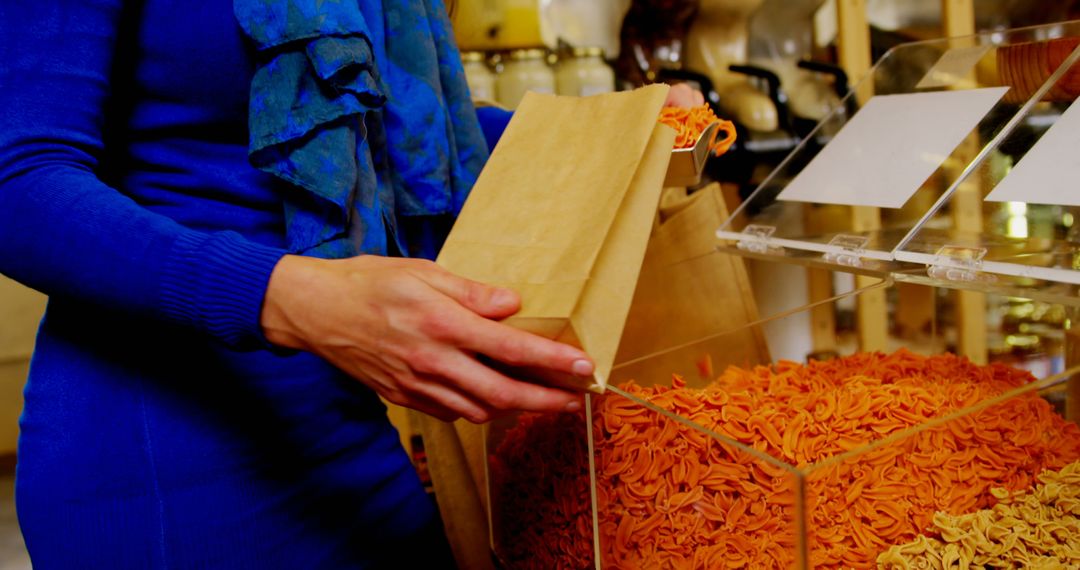 Person Shopping for Bulk Pasta in Grocery Store - Free Images, Stock Photos and Pictures on Pikwizard.com