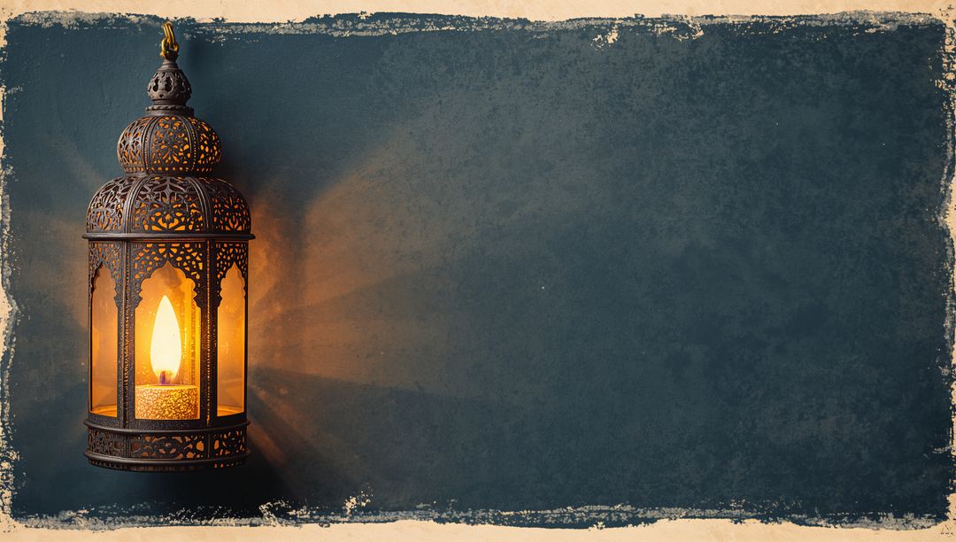 Hanging Moroccan Filigree Lantern Casting Warm Amber Glow on Textured Background with Paper Border
