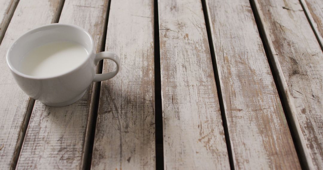 Close-up of White Mug with Milk on Rustic Wooden Table - Free Images, Stock Photos and Pictures on Pikwizard.com