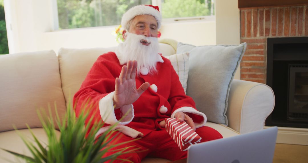 Santa Claus Waving During Virtual Christmas Call - Free Images, Stock Photos and Pictures on Pikwizard.com