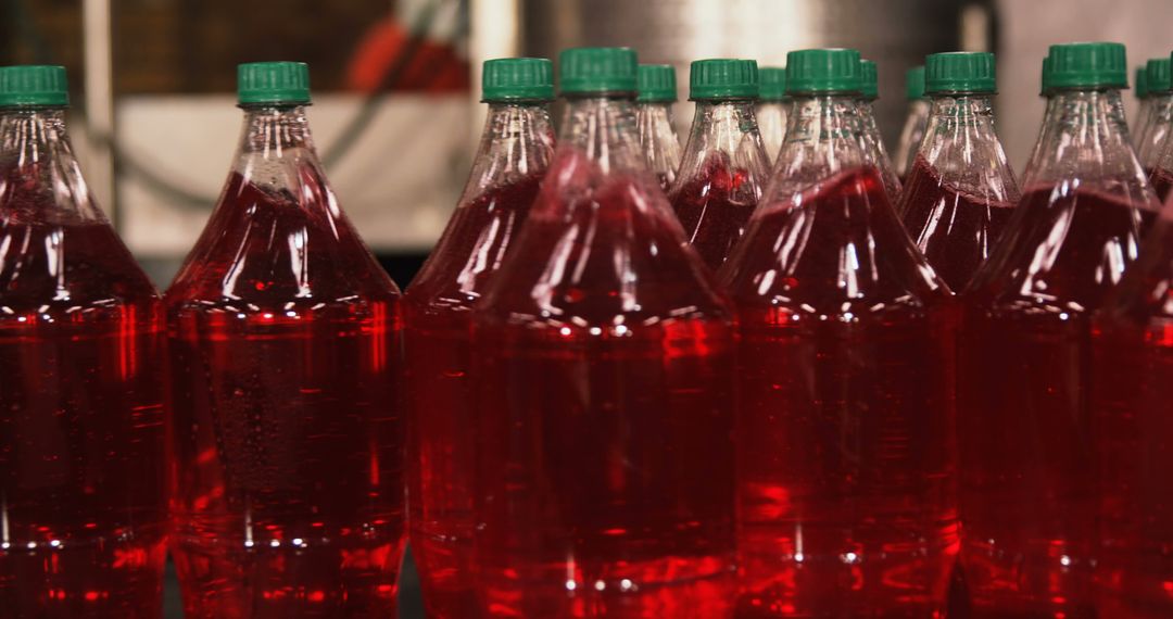 Close-Up of Multiple Plastic Bottles Filled with Red Liquid - Free Images, Stock Photos and Pictures on Pikwizard.com