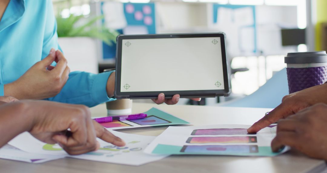 Team Working on Digital Project with Mockup Tablet in Office