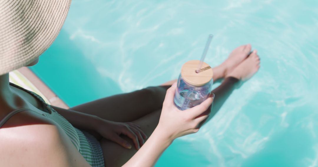 Relaxing Poolside with Glass Jar and Bamboo Lid in Summer