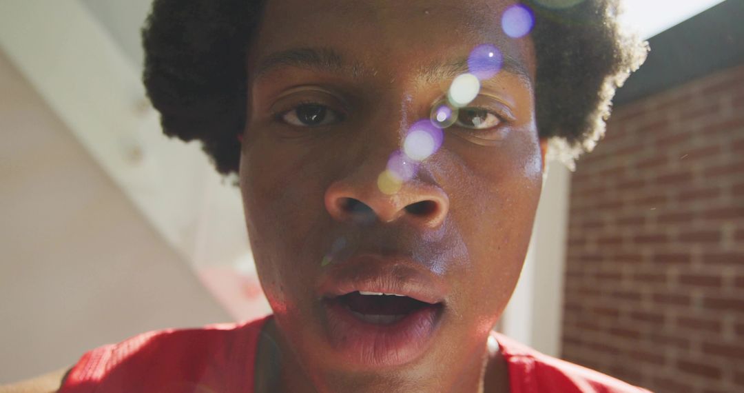 Vibrant Urban Portrait with Lens Flare in Loft Setting