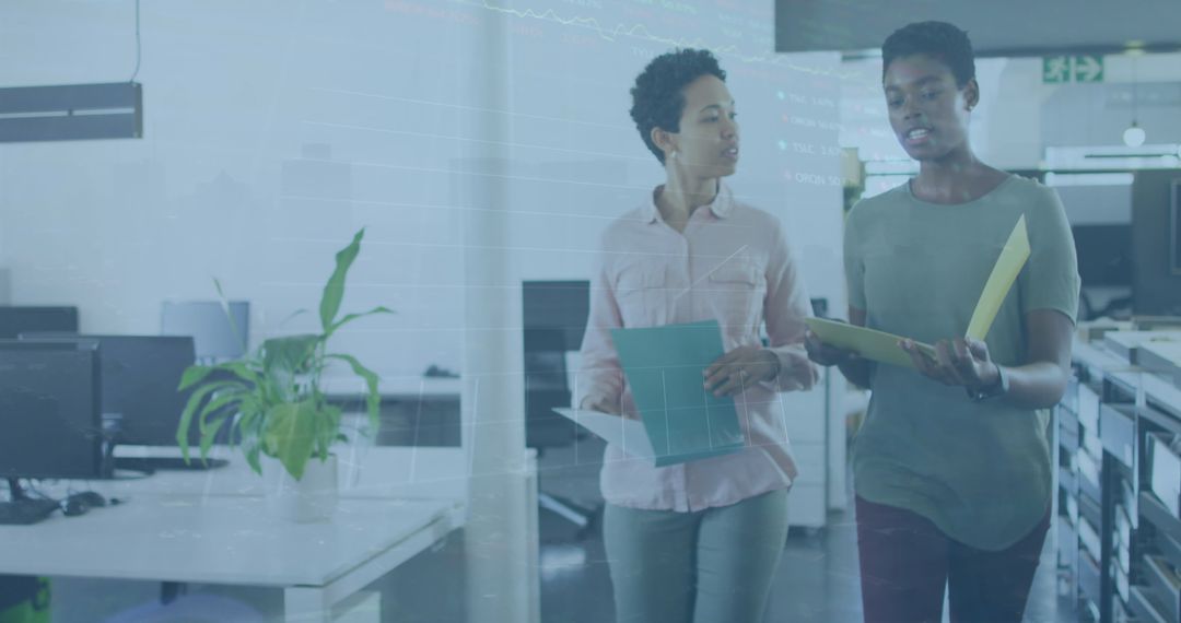 Business Professionals Discussing Overlapping Stock Market Data in Office Setting