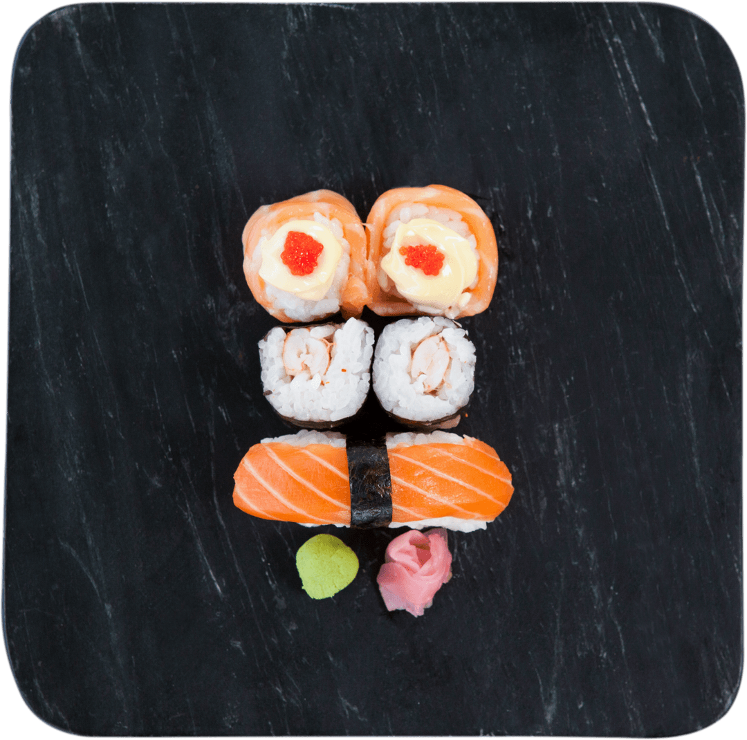 Assorted Fresh Sushi on Black Plate with Transparent Elements