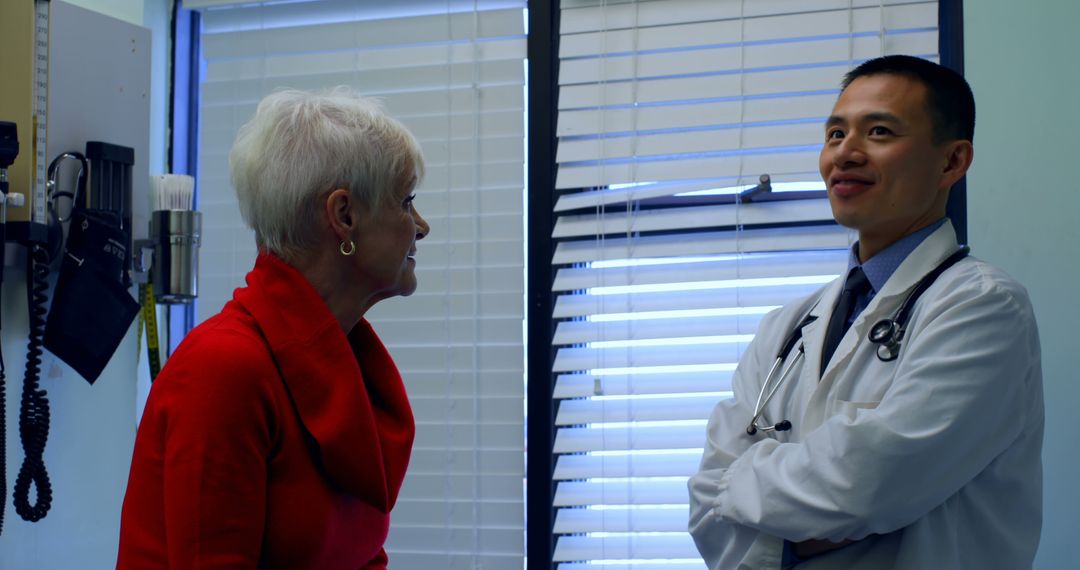 Elderly Patient Discussing Health Concerns with Doctor in Medical Office - Free Images, Stock Photos and Pictures on Pikwizard.com