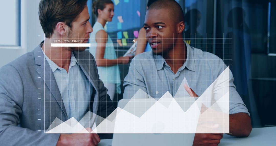 Diverse Businessmen Discussing Data Analysis in Modern Office