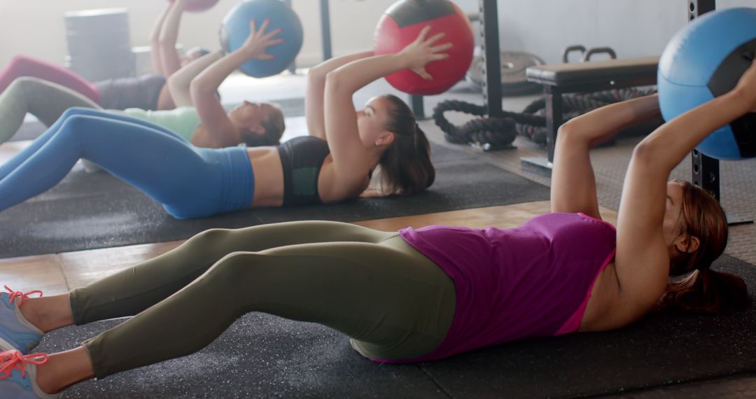 Group of Women Performing Medicine Ball Exercises in Fitness Class - Free Images, Stock Photos and Pictures on Pikwizard.com