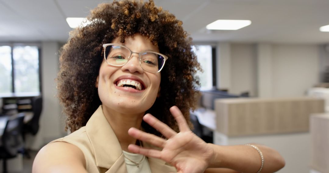 Smiling Businesswoman Taking Selfie in Modern Office Environment