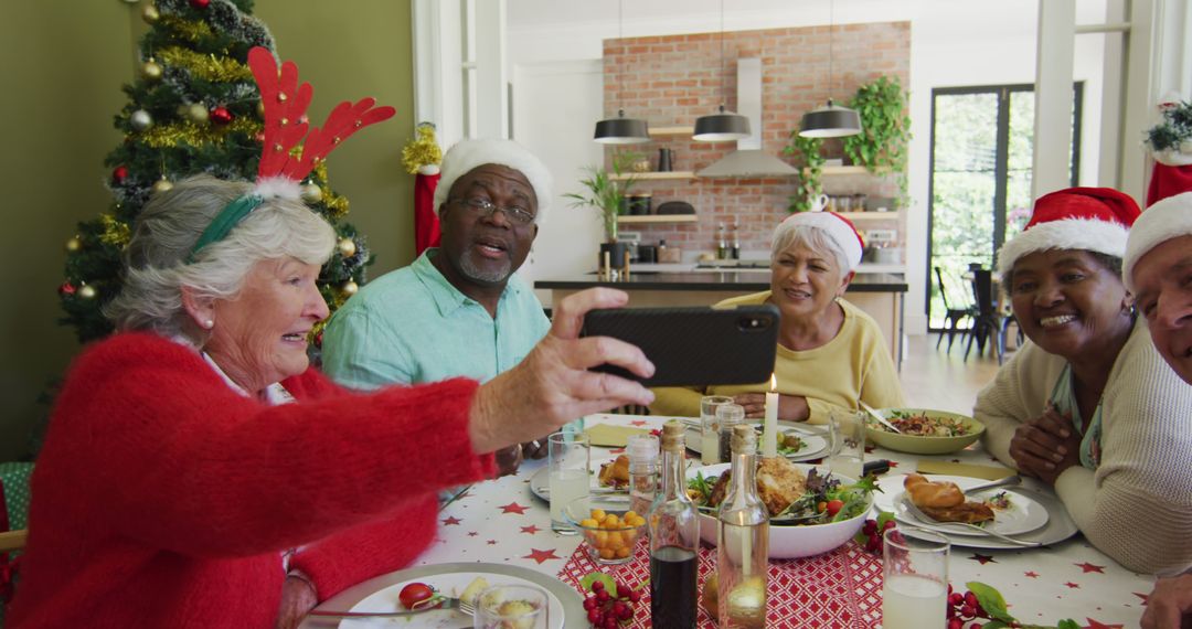 Seniors Enjoying Christmas Dinner Taking Selfie Together - Free Images, Stock Photos and Pictures on Pikwizard.com