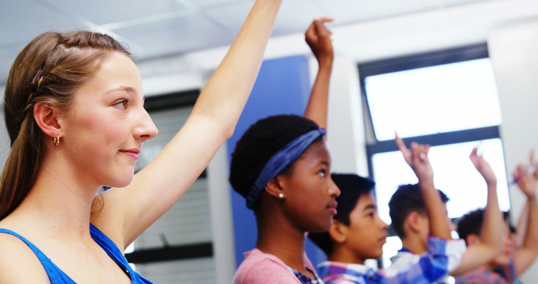 Diverse Group of Students Raising Hands in Classroom - Free Images, Stock Photos and Pictures on Pikwizard.com