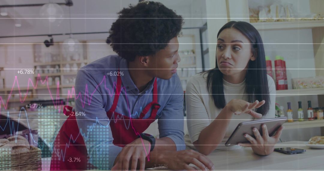 Cafe Team Analyzing Sales Statistics Using Tablet