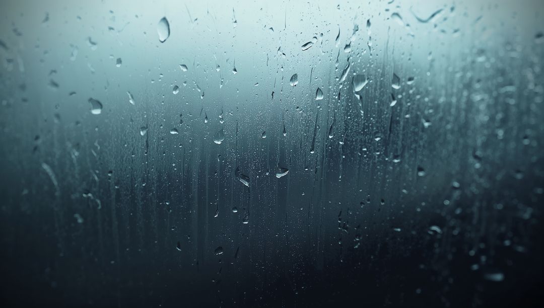 Raindrops Trickling Down Foggy Window Pane Creating Calming Atmosphere