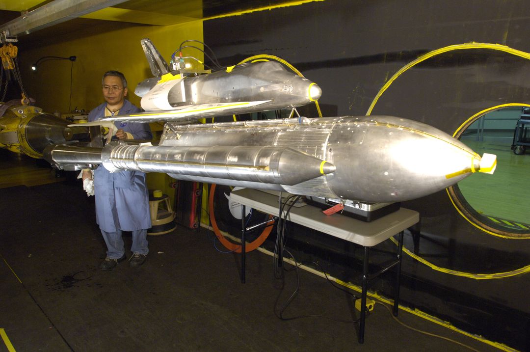 Engineer Testing Space Shuttle Scale Model In Wind Tunnel