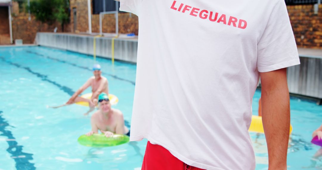 Lifeguard by Swimming Pool with Swimmers Enjoying Summer Activity - Free Images, Stock Photos and Pictures on Pikwizard.com