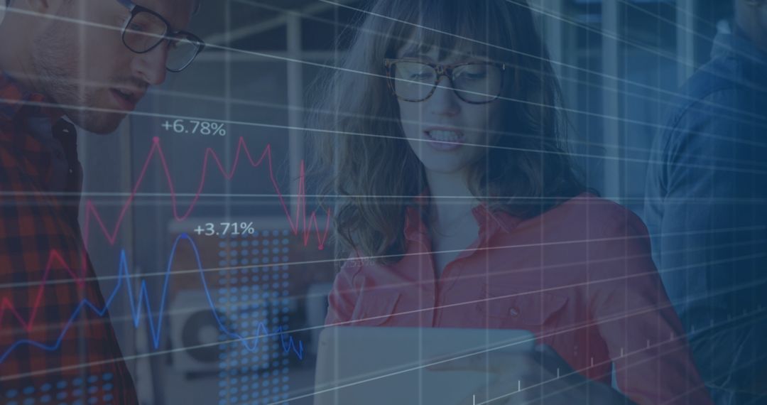 Business Professionals Analyzing Data with Overlayed Graphs
